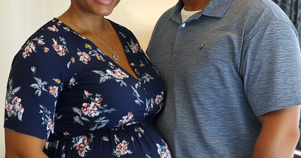 A mature Black woman receiving compassionate support during grief therapy.